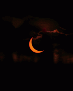eerie picture of crescent moon with cloud movement in background.gif